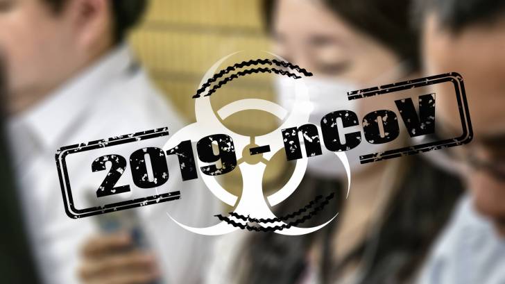 2019-ncov with people in the background with masks on