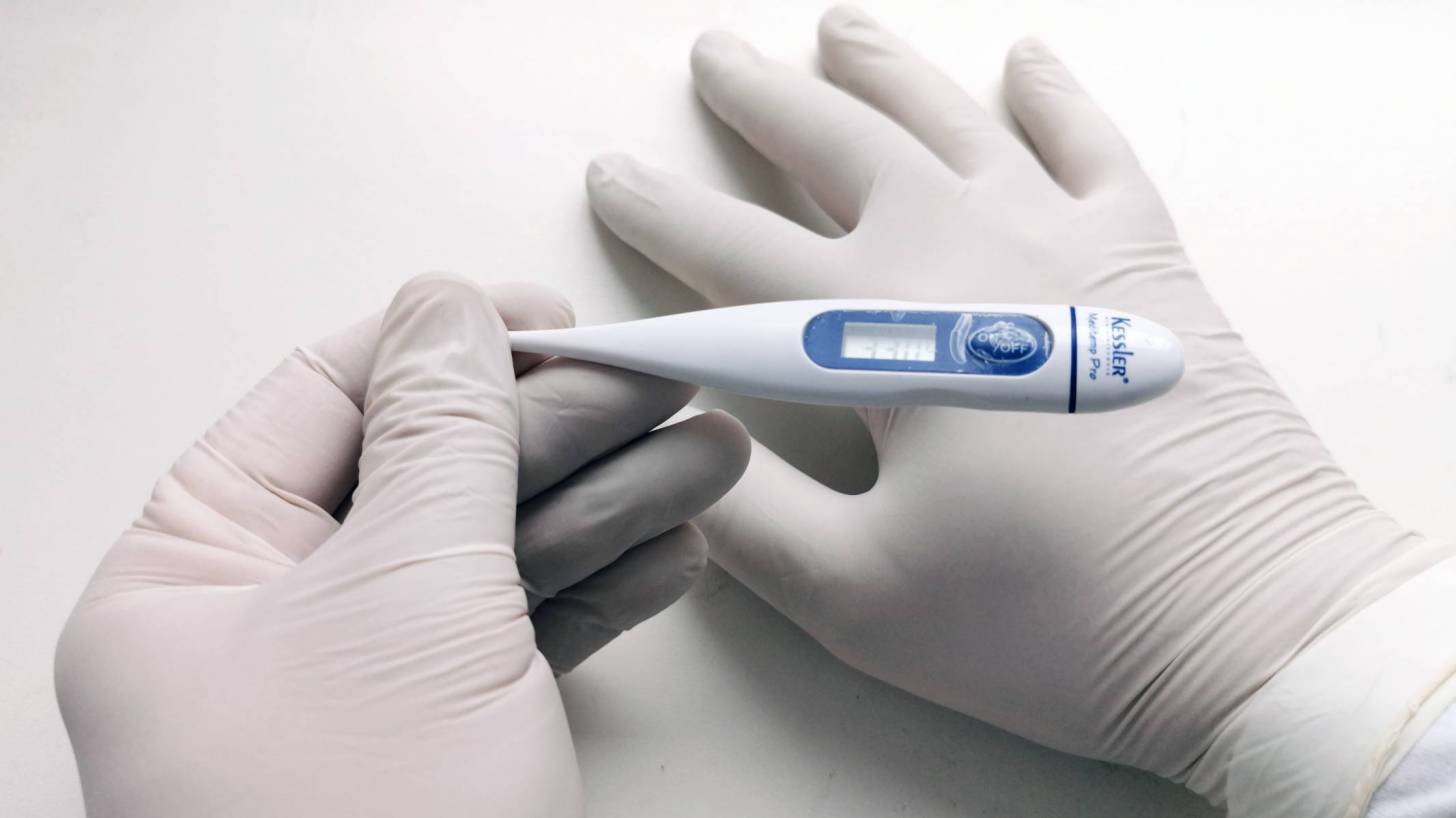 medical gloves with a thermometer