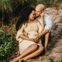 pregnant wife and husband smiling